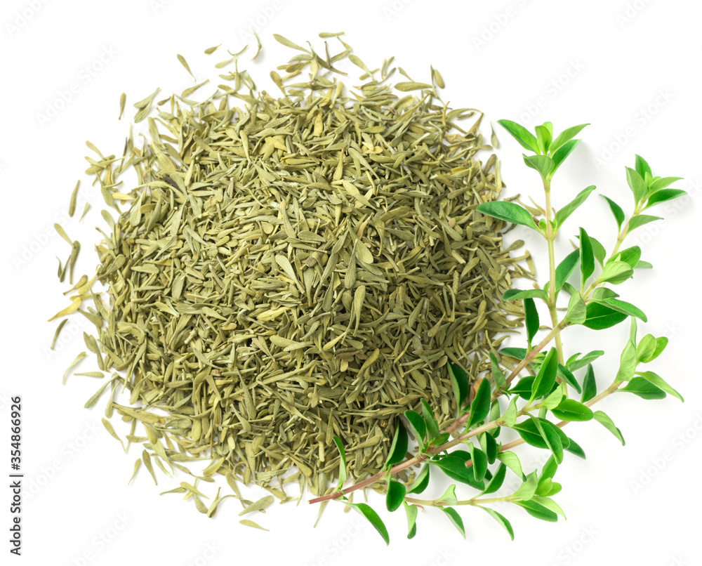 Wall mural dried thyme leaves and fresh thyme isolated on white background, top view