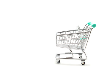 Miniature empty shopping cart on white background