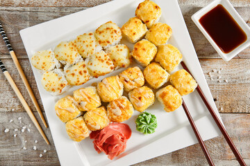 Baked rolls in white plate top view