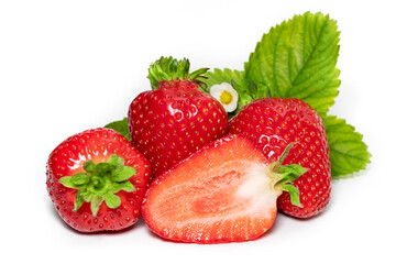 Isolated strawberries. Three fruits, one cut in half on white background
