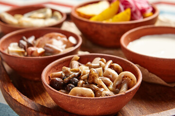 Snack assortment on wooden tray side view