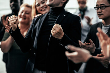close up. happy group of diverse business people standing together.