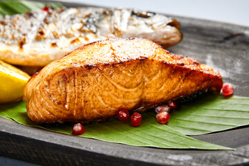 Fish served on wooden rustic plate