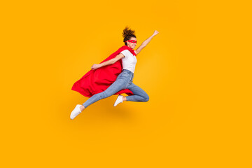 Full length body size view of her she nice attractive strong motivated energetic fit slim cheerful girl jumping wearing cape rescuing earth isolated bright vivid shine vibrant yellow color background - obrazy, fototapety, plakaty