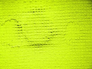 yellow background, texture of uneven painted  wall, light green plastered surface