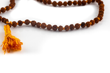 Rudraksha beads used in Hinduism for prayer, isolated on a white background.