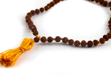 Rudraksha beads used in Hinduism for prayer, isolated on a white background.