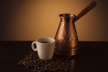 White Cup of coffee. Turka. Coffee bean. Brown background.