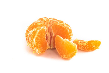 Satsuma Mandarinebeing unpeeled and quartered, isolated on a white background,