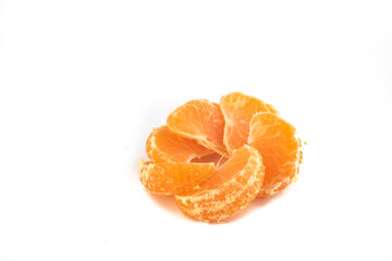 Satsuma Mandarine quarters isolated in a pattern on a white background,