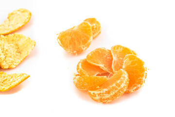 Satsuma Mandarine quarters isolated in a pattern on a white background,