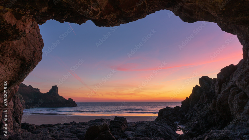 Wall mural sunset in cave over the sea - Wall murals