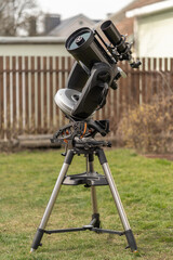An eight-inch Schmidt-Cassegrain telescope mounted on a fork-mount, equipped with an equatorial...