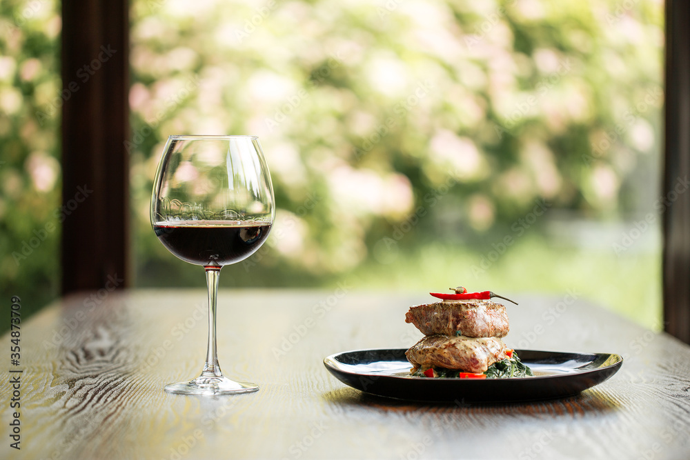 Wall mural fillet mignon steaks with sauce glass of red wine