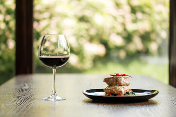 Fillet mignon steaks with sauce glass of red wine