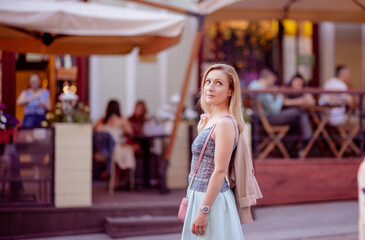 Beautiful young girl smiling on sunny street. Lifestyle Concept