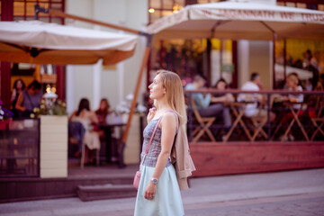 Beautiful young girl smiling on sunny street. Lifestyle Concept