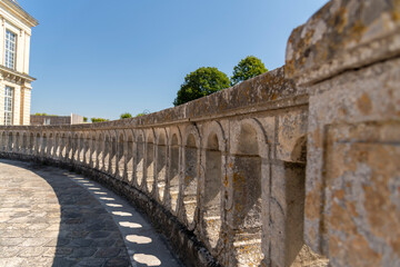 Medieval landmark royal hunting castle Fontainbleau near Paris in France and lake with white swans