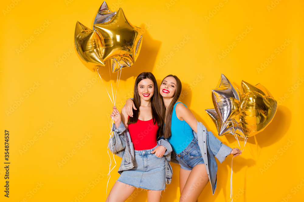 Canvas Prints Portrait of nice attractive pretty lovely charming stunning cheerful cheery glad girls holding in hands helium balls festive isolated on bright vivid shine vibrant yellow color background