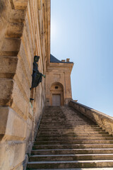 Medieval landmark royal hunting castle Fontainbleau near Paris in France and lake with white swans