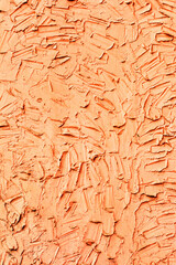 Creative beautiful bright orange background, cracks and scratches on the concrete. Grungy concrete surface. Great background or texture for your project.