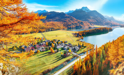 Stunning autumn scene over Sils im Engadin (Segl) village and Sils lake(Silsersee)
