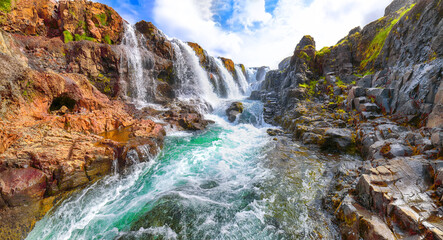 Captivating view of  Kolufossar waterfall at summer sunny day.