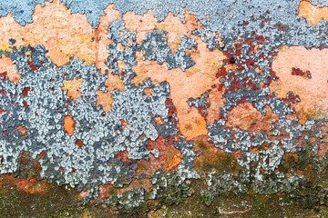 Abstract background concrete painted yellow, red, purple, blue paint, weathered with cracks and scratches. Landscape style. Grungy Concrete Surface. Great background or texture.
