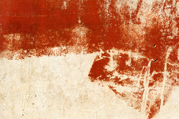 Vintage old damaged wall with cracks, scratches, painted with red paint. Textured background for your concept or project. Great background or texture.