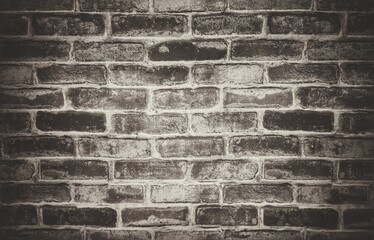 Old vintage retro style dark bricks wall for brick background and texture.