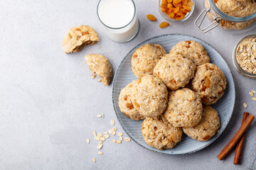 Healthy vegan oat cookies with milk. Grey background. Copy space. Top view.