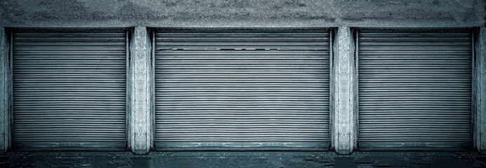 Steel shutter door of warehouse, storage or storefront for background and textured. 
