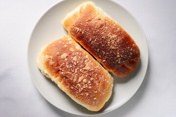 Top view of homemade buns in a gray plate