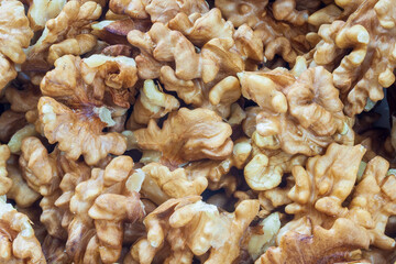 Pieces of chopped walnut as an abstract background
