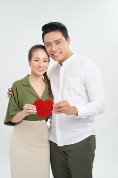 young love couple holding red heart, happy smile embrace, isolated over white background, valentine day concept