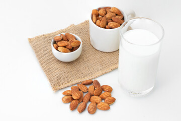 Milk Almonds in a glass on a white background
