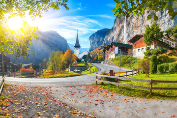 Stunning autumn view of Lauterbrunnen village with awesome waterfall  Staubbach  and Swiss Alps in the background