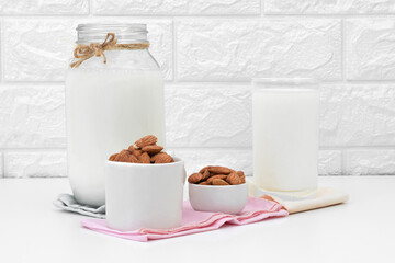 Milk Almonds in a glass on a white background