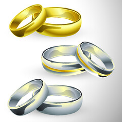 Gold and silver wedding rings in pair on isolated background