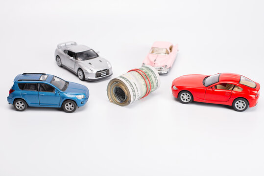 Earn cash with your car concept. Side profile full photo picture of small white car with rolls piles of usd money on top isolated bright color background with copyspace card