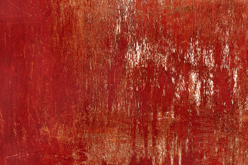 Creative wooden surface with scratches painted bright red. Textured background for your concept or project. Great background or texture.