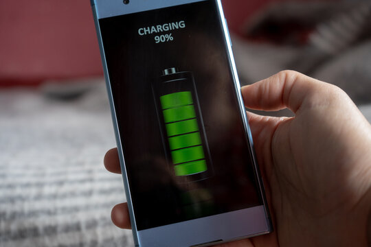wireless smartphone charging concept, full green battery icon on a phone screen