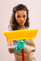 Portrait of african-american housewife who doesn't like cleaning.