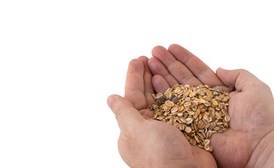 Fresh granola. muesli in hands on a white background