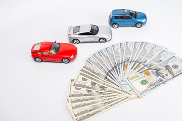 Miniature car model and Financial statement with coins. Finance and car loan, saving money for a...