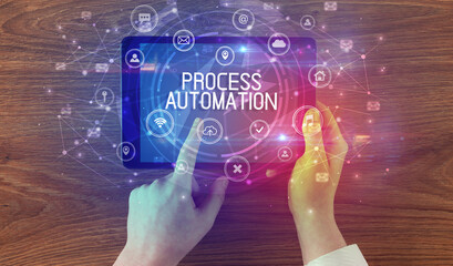 Close-up of a tablet with PROCESS AUTOMATION inscription, innovative technology concept