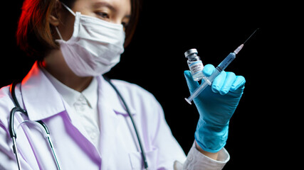 Doctor hand holding coronavirus vaccine shot for diseases outbreak vaccination, medicine and drug...