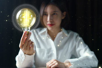 Woman hand holding light bulb. idea concept with inspiration.
