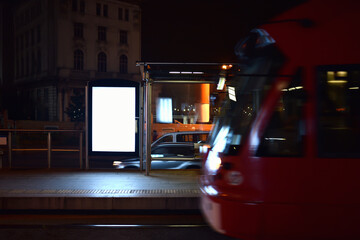 lightbox of outdoor advertising on tram stop in night