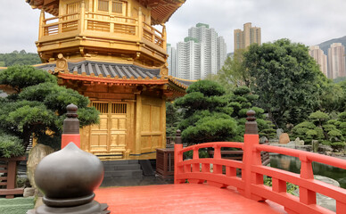 Golden pagoda, red bridge in the park